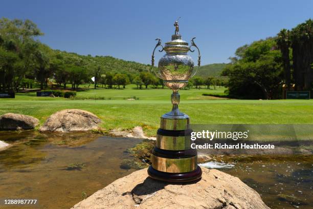 The South African Open Trophy sits behind the 18th green during a practice round for the South African Open at Gary Player CC on December 02, 2020 in...