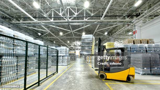 glass bottle factory storage - forklift truck warehouse stock pictures, royalty-free photos & images