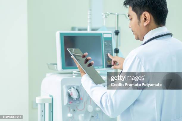 asian healthcare and medicine. doctor using dialysis machine, doctor with stethoscope in hospital, medical equipment concept. - dialysis stock-fotos und bilder