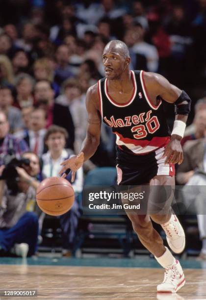 Terry Porter, Point Guard for the Portland Trail Blazers dribbles the basketball down court during the NBA Midwest Division basketball game against...