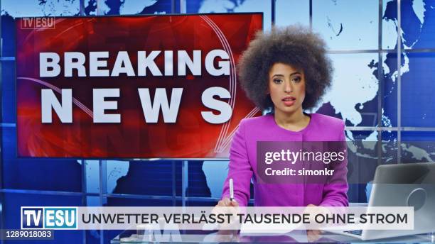 female anchor presenting breaking news about severe weather causing power outage - breaking news stock pictures, royalty-free photos & images