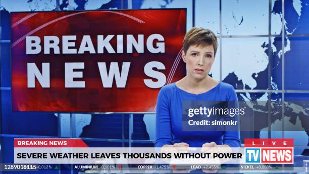 female anchor presenting breaking news about severe weather causing power outage - breaking news stock pictures, royalty-free photos & images
