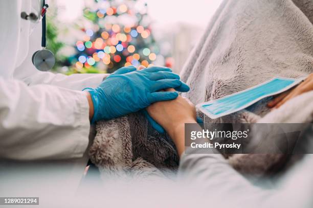 healthcare worker giving support and love to a patient - national holiday stock pictures, royalty-free photos & images