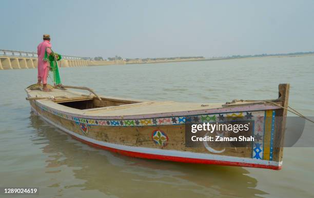 fisherman of the indus valley pakistan - indus river pakistan stock pictures, royalty-free photos & images