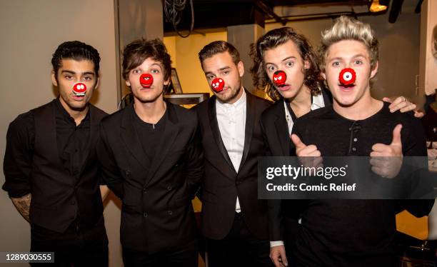 British-Irish boyband One Direction , wearing red noses on Red Nose Day's big night of TV, Comic Relief Face the Funny, live from the London...