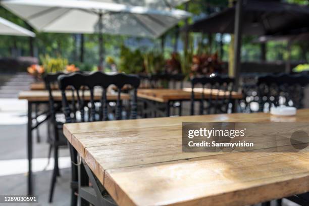 close-up of empty table - cafe table chair outside ストックフォトと画像