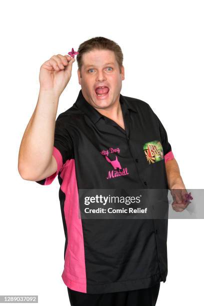 Scott Mitchell poses in the studio to promote the Comic Relief special 'Let's play darts' for sport relief 2016 in London, England."u2028"u2028