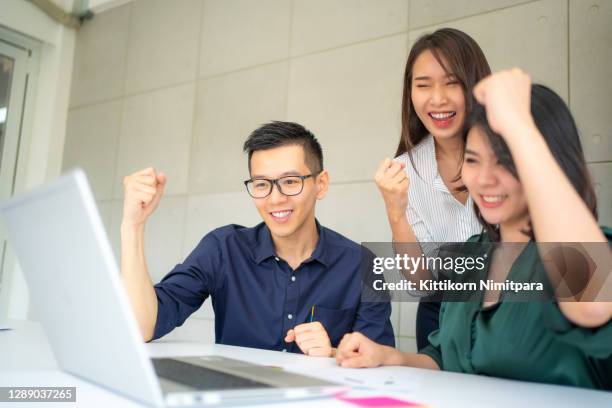 group of business showing hand rise in office;success concept. - effortless experience stock pictures, royalty-free photos & images