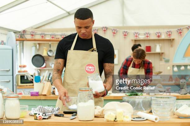 Jermaine Jenas measures ingredients whilst Louise Redknapp dives into her baking task, in the background, for the Comic Relief special episode of the...