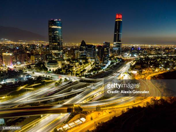 aerial view of santiago de chile at night - santiago chile stock pictures, royalty-free photos & images