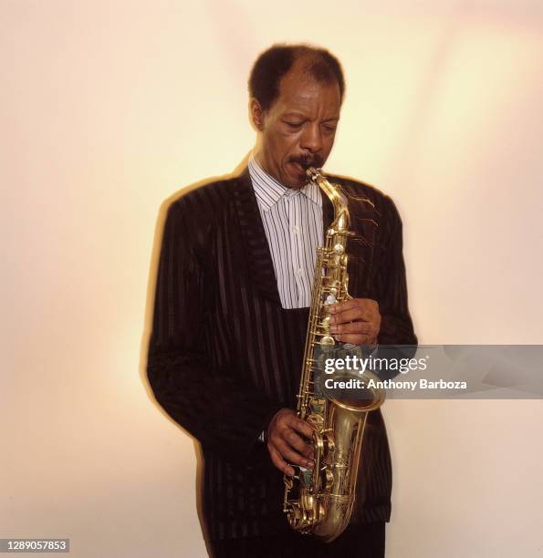 Portrait of American Jazz musician and composer Ornette Coleman as he plays saxophone, New York, 1977.