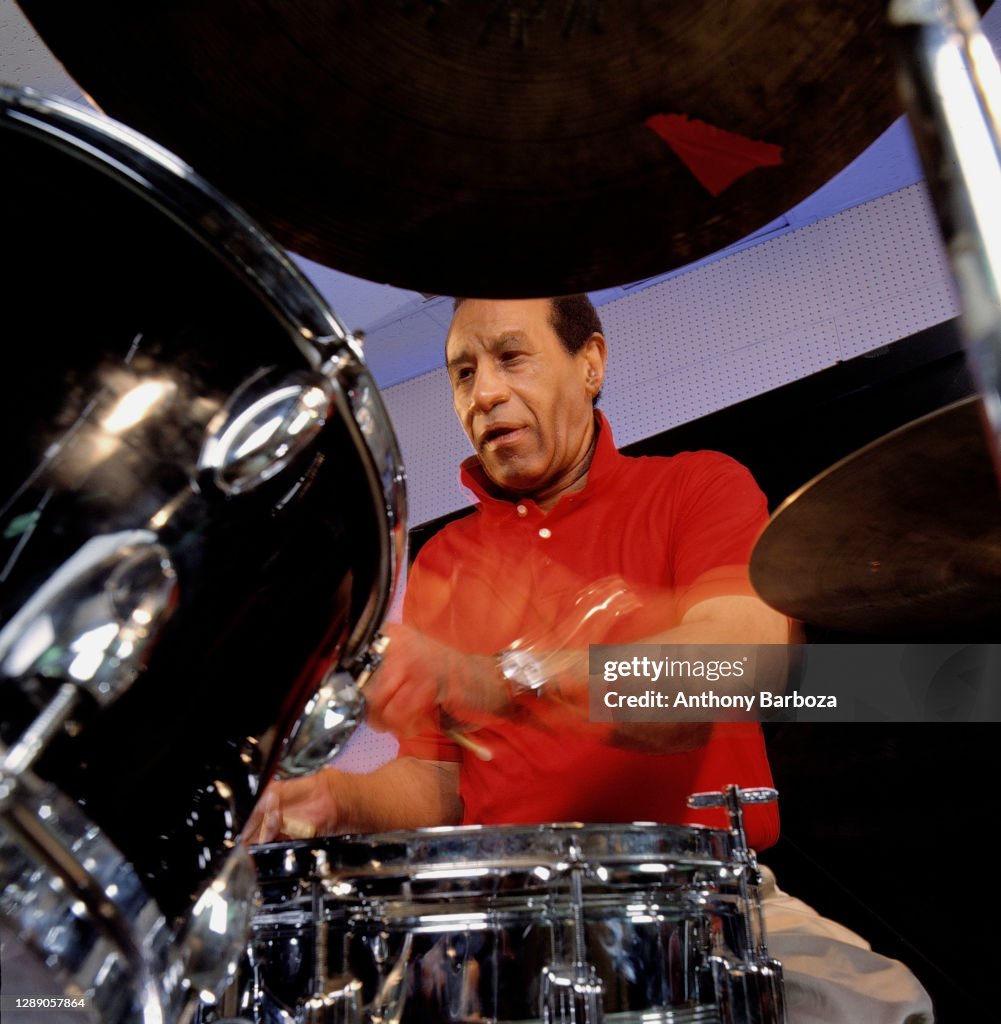 Max Roach Instrument Low-angle view of American Jazz musician Max Roach as he plays drums ...