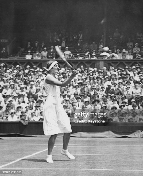Hilde Krahwinkel of Germany makes a return against compatriot Cilly Aussem during their Women's Singles Final match at the Wimbledon Lawn Tennis...