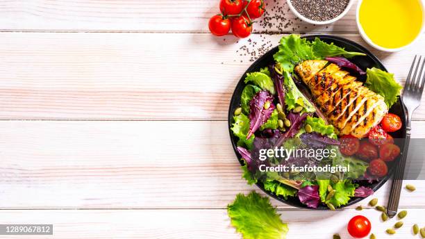 chicken salad plate shot from above on white table. copy space - chicken salad stock pictures, royalty-free photos & images