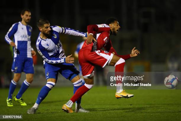 Max Ehmer of Bristol Rovers challenges Vadaine Oliver of Gillingham during the Sky Bet League One match between Bristol Rovers and Gillingham at...