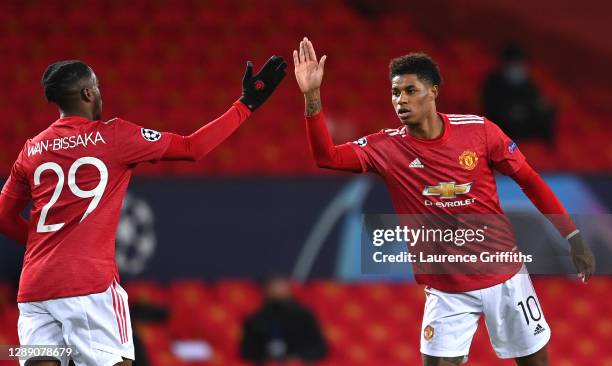 Marcus Rashford of Manchester United celebrates with team mate Aaron Wan-Bissaka after scoring their sides first goal during the UEFA Champions...