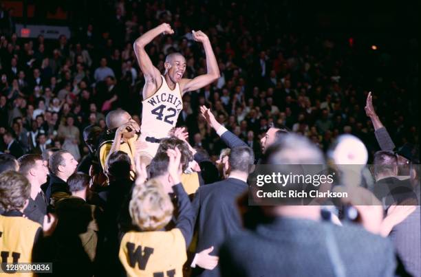 Dave Stallworth of the Wichita Shockers celebrates on the shoulders of his teammates following a win over the Cincinnati Bearcats on February 16,...