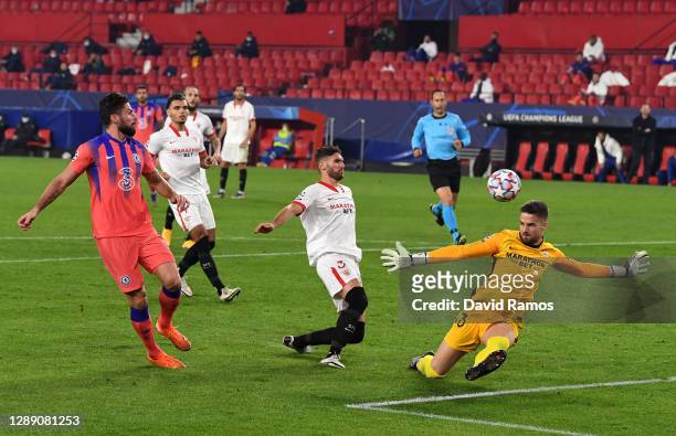 Olivier Giroud of Chelsea scores their sides second goal during the UEFA Champions League Group E stage match between FC Sevilla and Chelsea FC at...