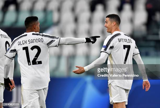 Cristiano Ronaldo of Juventus celebrates with team mate Alex Sandro after scoring their sides second goal during the UEFA Champions League Group G...