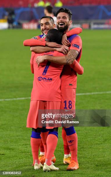 Olivier Giroud of Chelsea celebrates with teammates Hakim Ziyech and Ngolo Kante after scoring their team's third goal, their hat-trick during the...