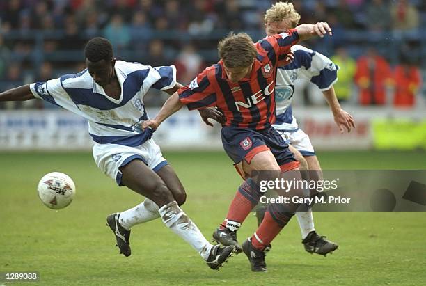 Tony Cottee of Everton holds onto Clive Wilson of Queen Park Rangers during an FA Carling Premiership match at Loftus Road in London. Queen Park...