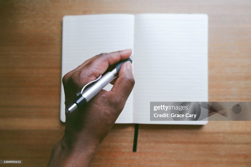 Woman Writes in Notebook