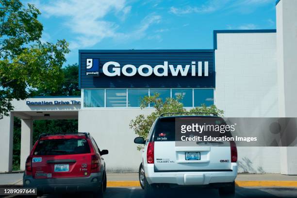 Store sign and drive-thru donation alley for Goodwill Industries.