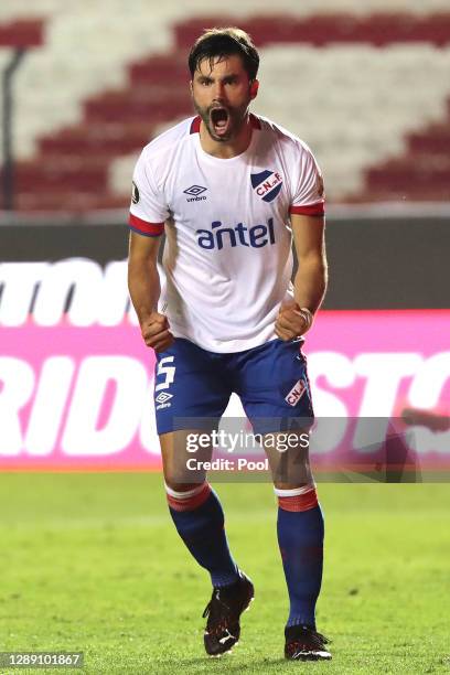 Claudio Yacob of Nacional celebrates after scoring the third penalty in the penalty shootout during a round of sixteen second leg match of Copa...