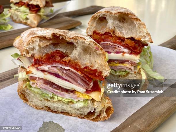 close-up of halved italian sub sandwich - submarine sandwich imagens e fotografias de stock