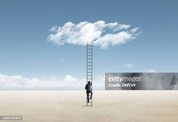 man climbing ladder of opportunity - ladder imagens e fotografias de stock