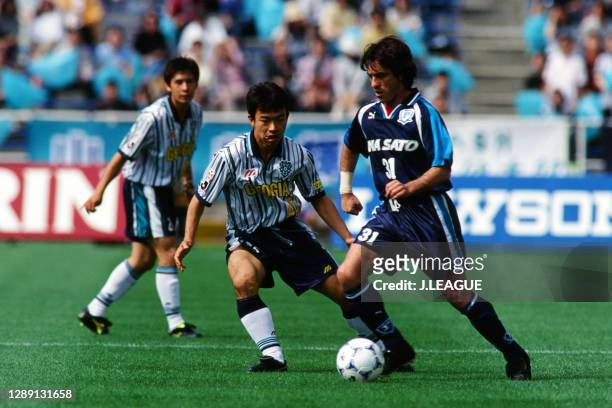 Paulo Futre of Yokohama Flugels controls the ball under pressure of Yuji Okuma of Avispa Fukuoka during the J.League first stage match between Avispa...