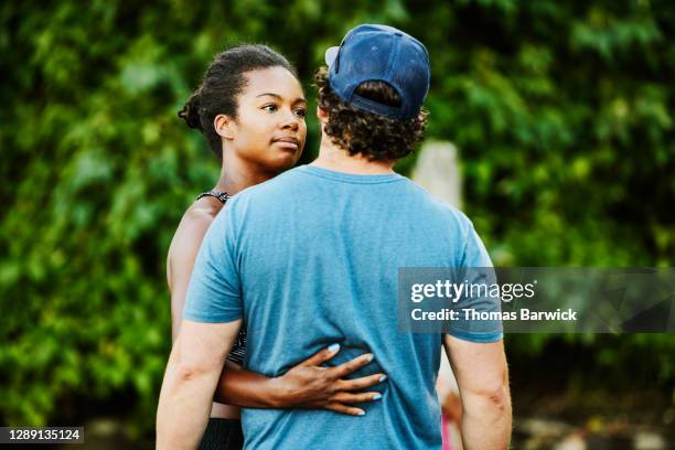 wife embracing husband during summer afternoon at beach - share my wife photos stock pictures, royalty-free photos & images