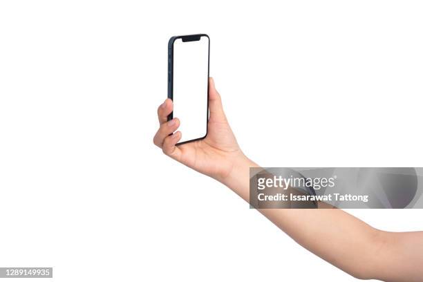 hand hold girl having video-call with lover holding smart phone in hand shooting selfie on camera isolated on white background - taking selfie white background stockfoto's en -beelden