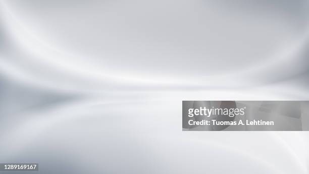 abstract and modern gray background with brighter blurred curved lines. - grau stock-fotos und bilder