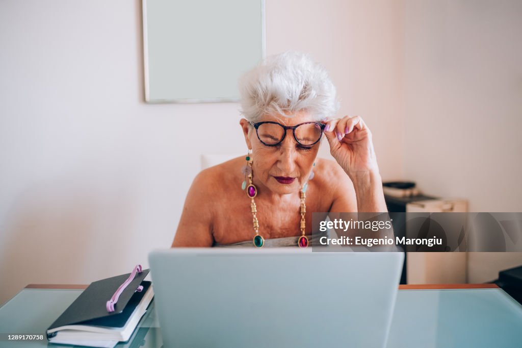 Woman working on laptop at home
