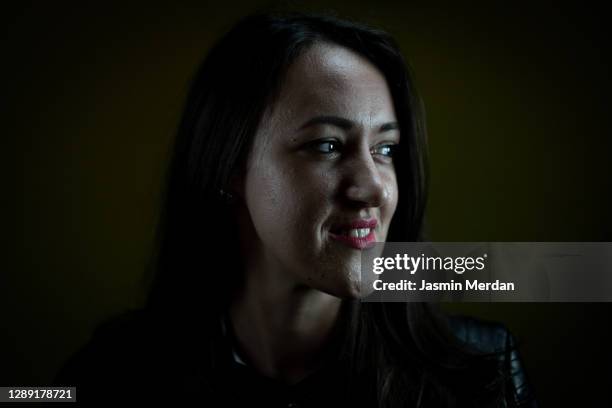 headshot of self-confident businesswoman on dark background - portrait professional dark background stock pictures, royalty-free photos & images