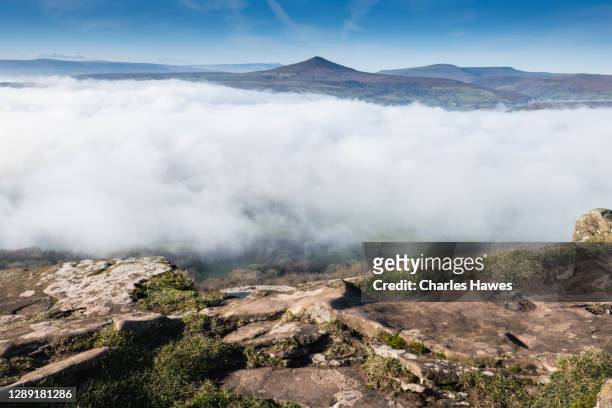 cloud inversion and view to sugar loaf;image taken from the skirrid in monmouthshire, south wales, uk. november - inversion_(meteorology) stock-fotos und bilder