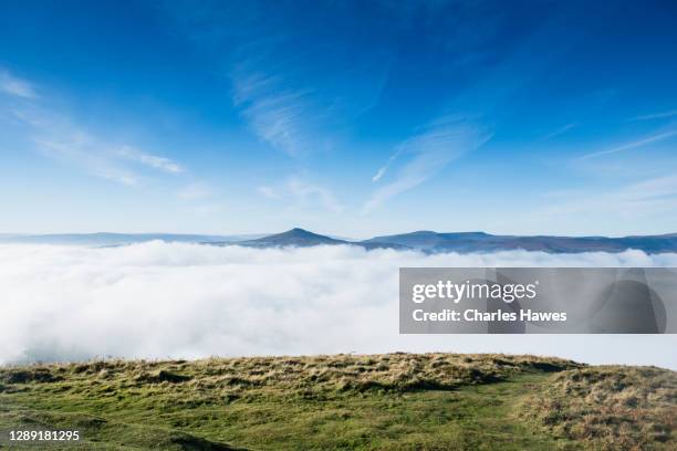 cloud inversion and view to sugar loaf;image taken from the skirrid in monmouthshire, south wales, uk. november - inversion_(meteorology) stock-fotos und bilder