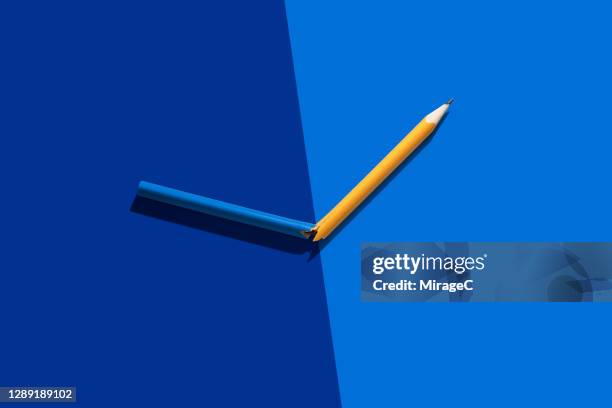 pencil cracked into two colors - rotation concept stock pictures, royalty-free photos & images