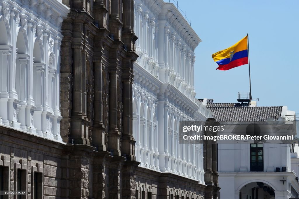 Waving national flag over the seat of government Palacio de Carondelet, Quito, Pichincha Province, Ecuador