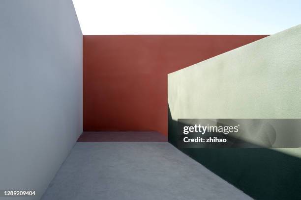 corridor composed of colored concrete walls, with sunlight effect - art from the shadows stock pictures, royalty-free photos & images