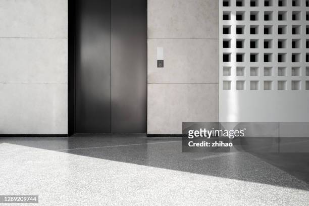 elevator entrance with sunlight effect - elevator door stock pictures, royalty-free photos & images