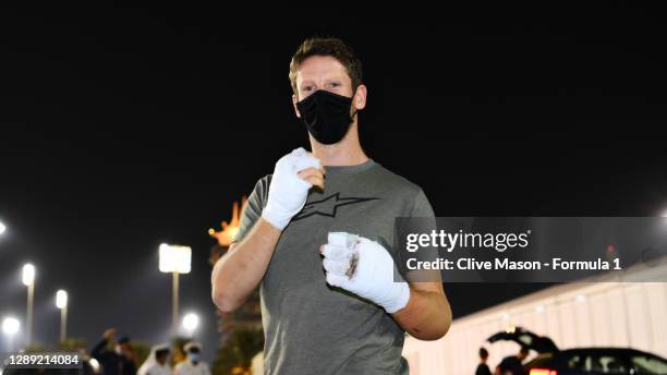 Romain Grosjean of France and Haas F1 walks in the Paddock with bandages on his burnt hands after his crash at the previous race during previews...