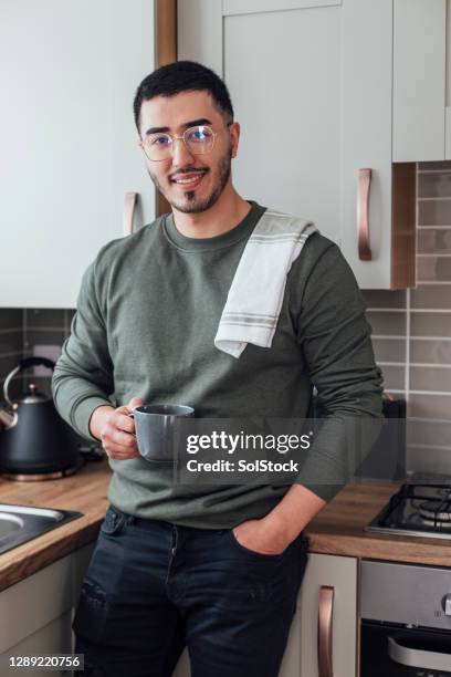 chilling in the kitchen - dish towel stock pictures, royalty-free photos & images