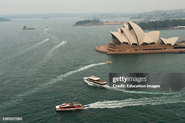 Bush fire smoke haze, Opera House and small boats from above.