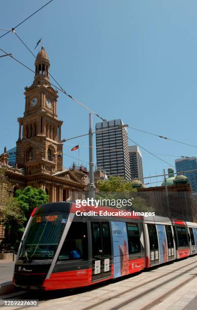 Sydney Light Rail, TRAM, in background, Town Hall clock tower.
