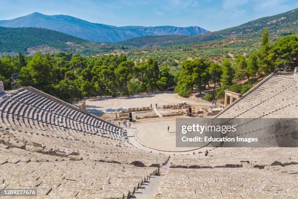 Epidaurus, Argolis, Peloponnese, Greece. The 14th century BC 000 seat theatre, designed by Polykleitos the Younger. The original 34 rows were...