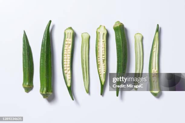 okra slices and whole okra - okra stock pictures, royalty-free photos & images