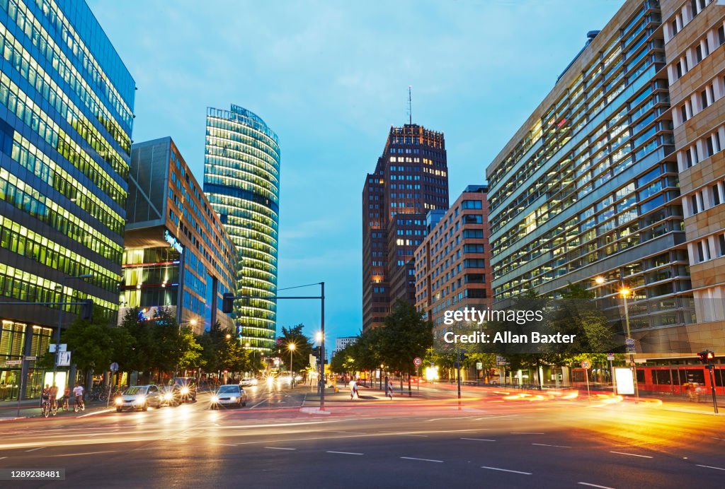Modern architecture along Potsdamer Strabe illuminated at dusk