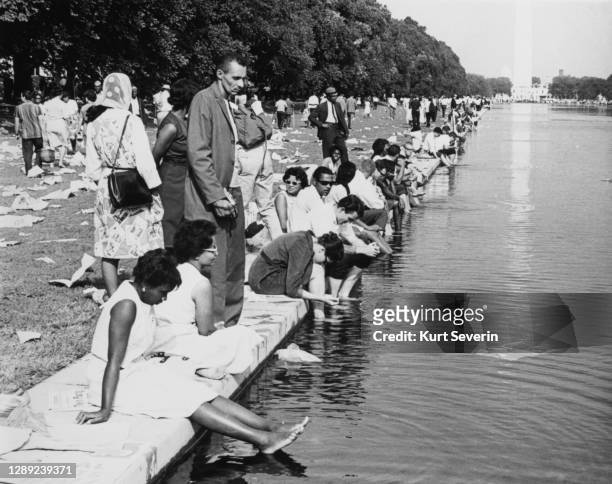 Participants cool their feet in the waters of the Lincoln Memorial Reflecting Pool after the March on Washington for Jobs and Freedom, Washington DC,...